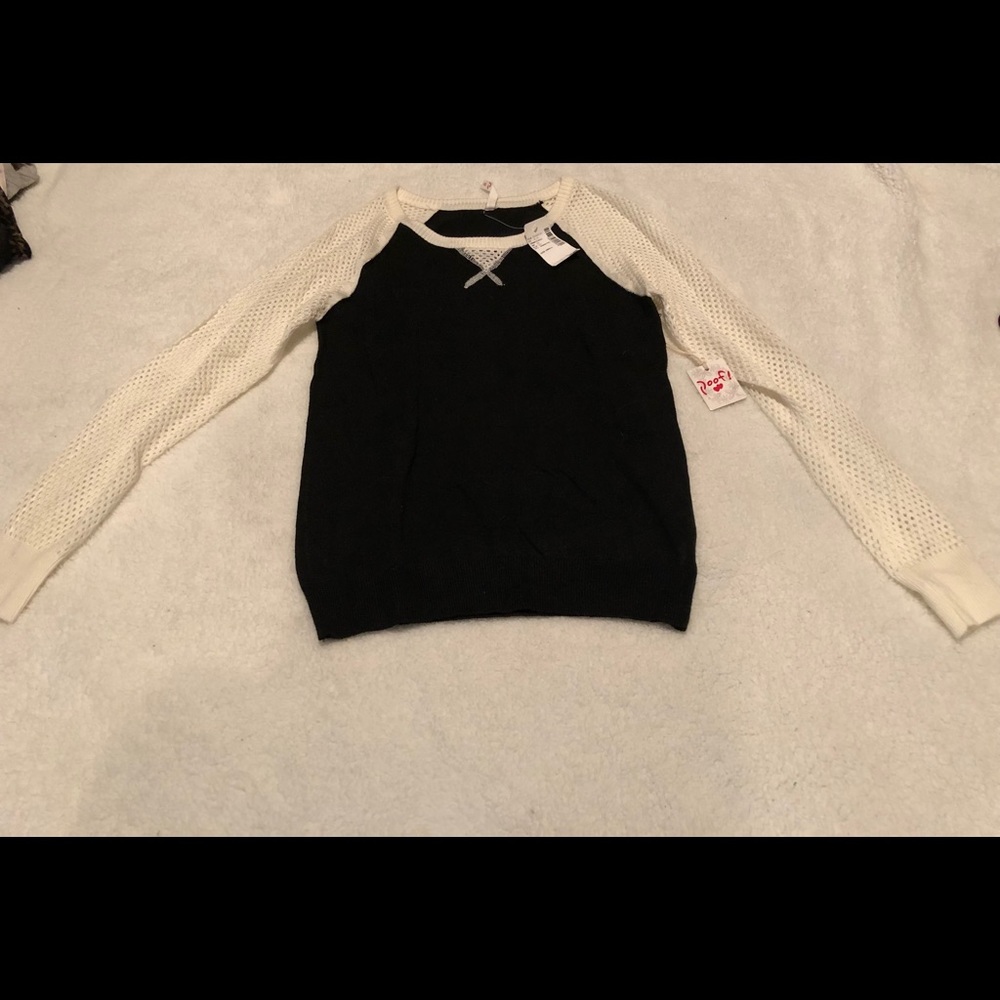 Sweater with see through sleeves.